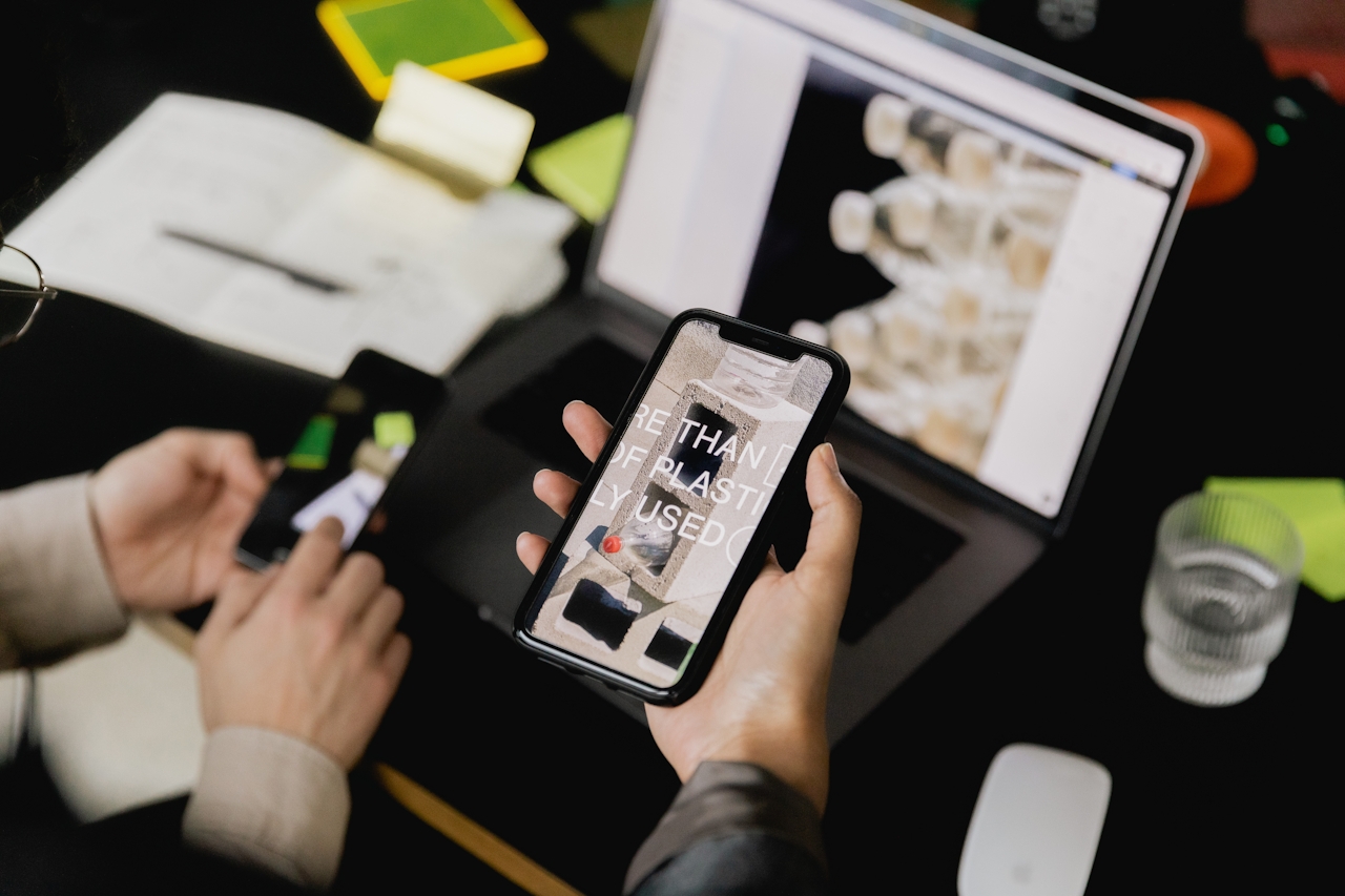 A photo of many people working on a phone and computer, used as the promotional image for a piece on sales and buyer psychology.